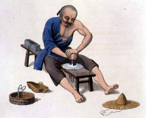 An Old Man Polishing Crystals