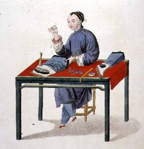 A Woman Making Stockings